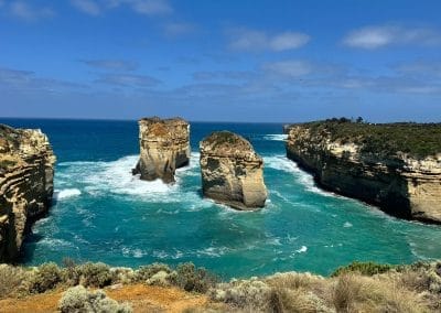 Scenic coastal rock formations surrounded by turquoise waters on the Great Ocean Road