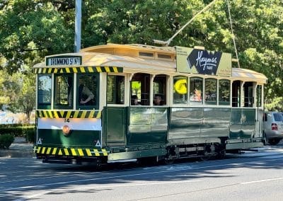 A vintage green and yellow tram.